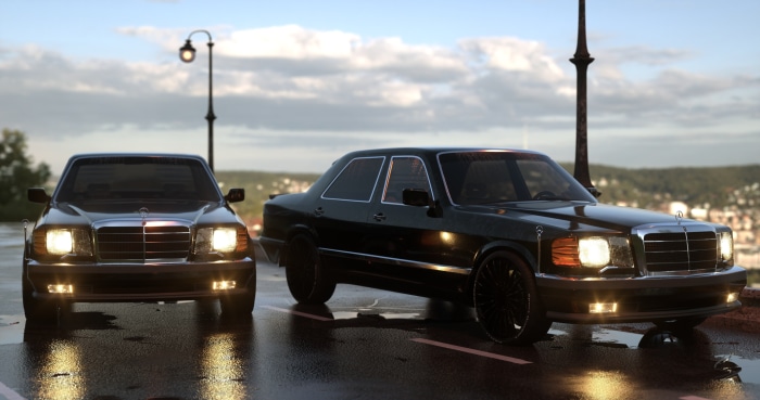 Two black Mercedes-Benz cars on a wet road