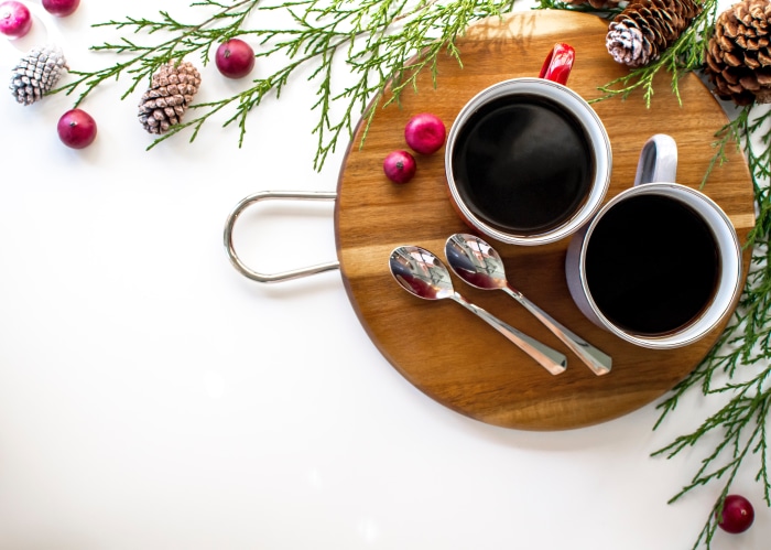 Two cups of coffee with Christmas decorations
