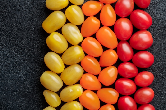 Assortment of yellow, orange, and red cherry tomatoes