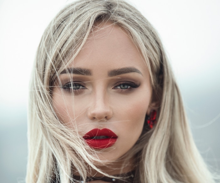 Woman with blonde hair and red lipstick