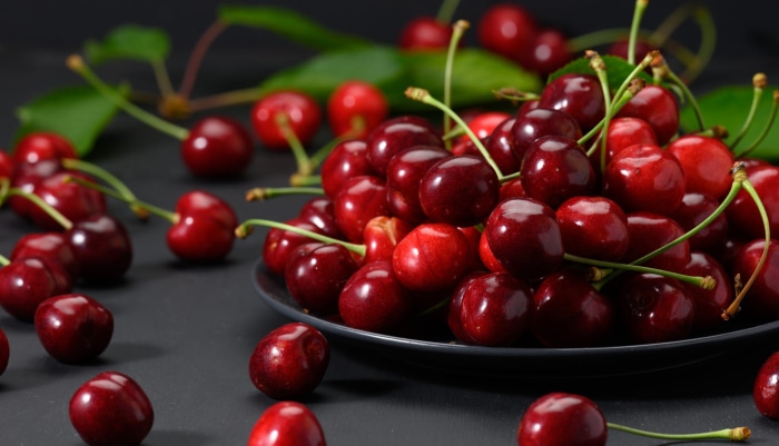Cherries on a dark surface