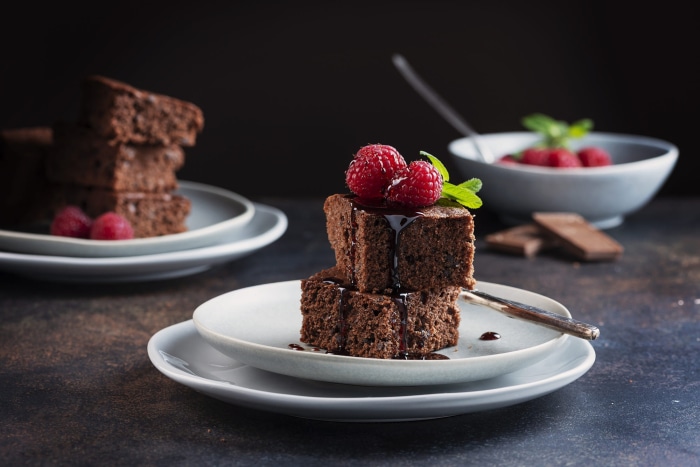 Chocolate brownies with raspberries and mint