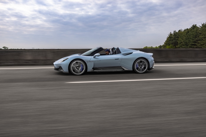 Maserati MC20 Cielo convertible driving on highway