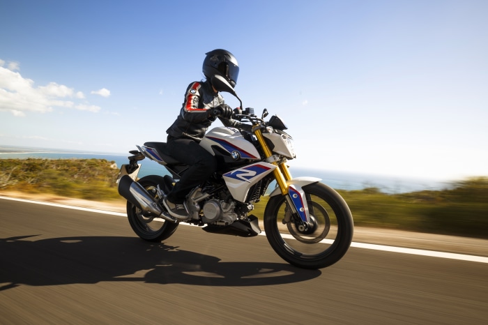 BMW G310R motorcycle on a coastal road 4K