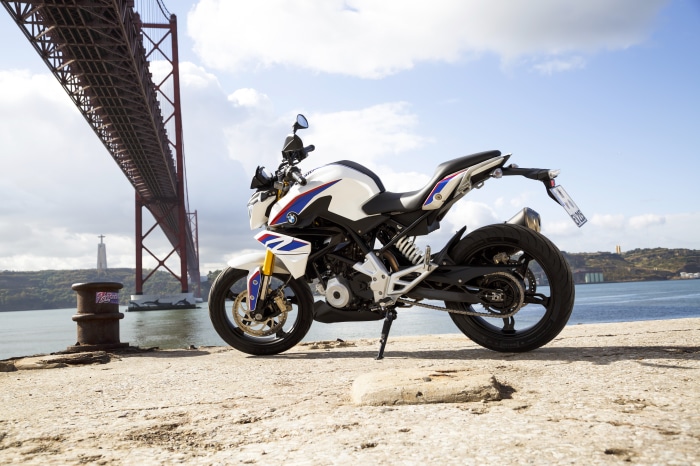 BMW G310R motorcycle by a bridge