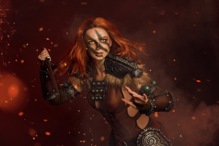 Cosplayer dressed as a Skyrim warrior with face paint