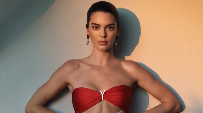 Kendall Jenner in red strapless top with Y logo