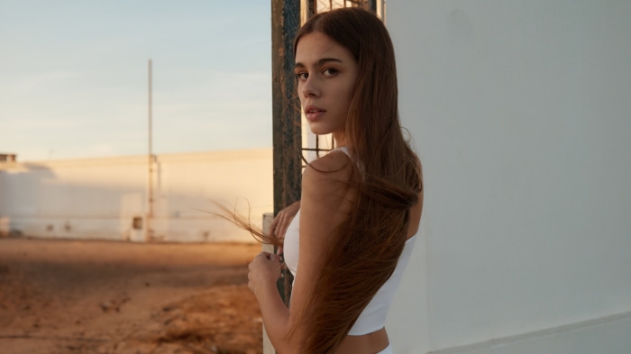 Model with long brown hair in natural light 4K