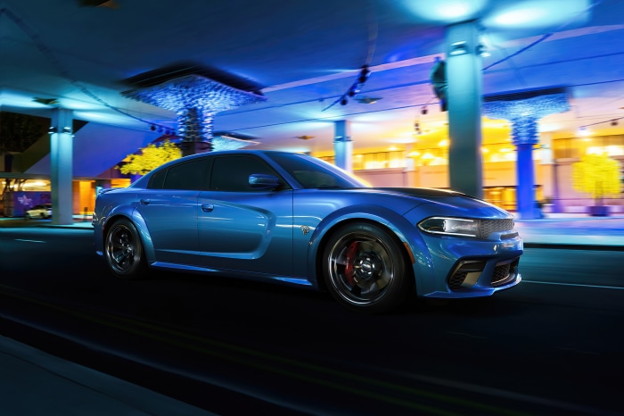 Blue Dodge Challenger SRT Hellcat Widebody driving at night