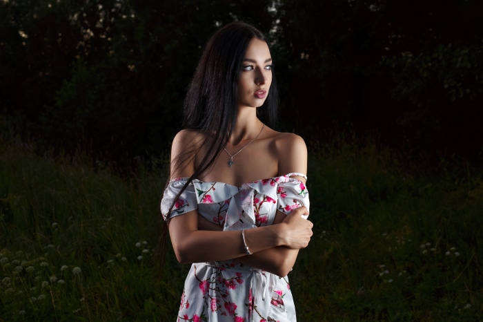 Brunette model in an elegant floral dress