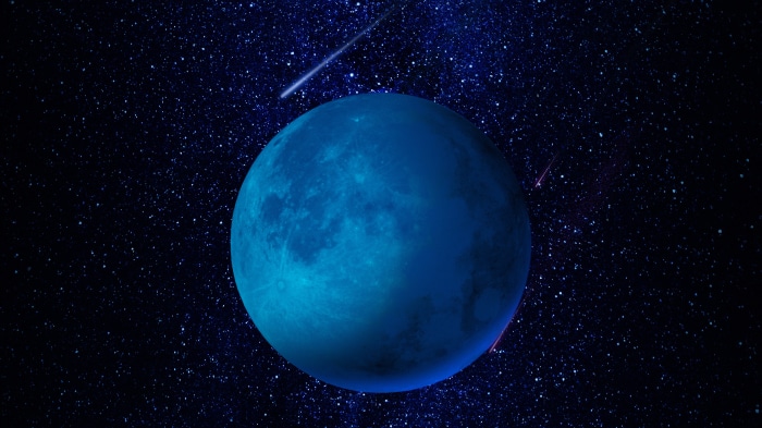 Blue planet in a starry universe with shooting stars