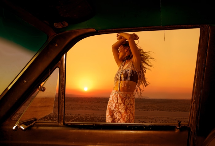 Olivia Wilde dancing in desert at sunset