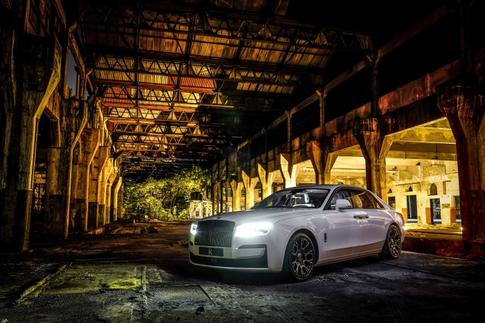 White Rolls-Royce Ghost in abandoned industrial building