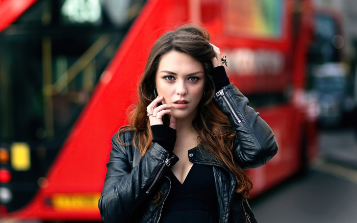 Imogen Dyer in front of a red bus