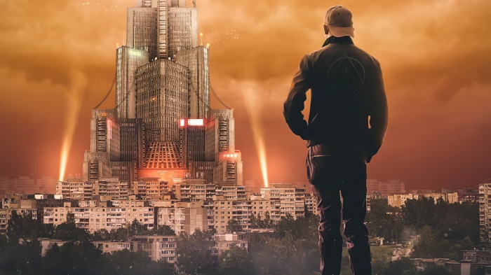 Man in cap looking at futuristic city