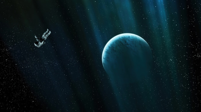 Astronaut floating near a planet in space