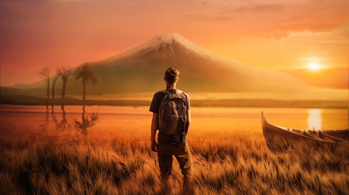 Man with backpack facing mountain at sunset 4K