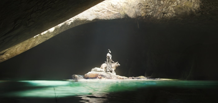 A figure on a wolf in a cave with water