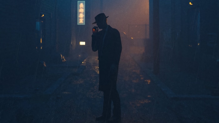 Man in fedora smoking in a rainy alleyway