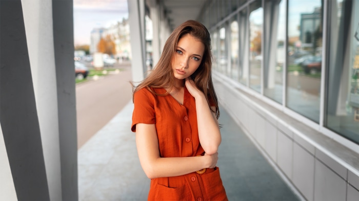 Portrait of a Young Woman in Orange Outfit