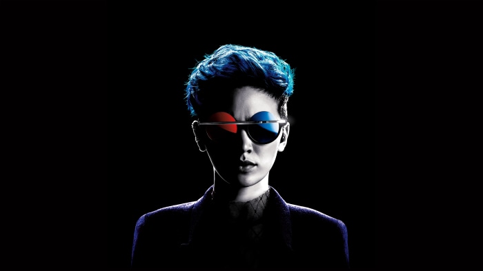 Person with blue hair and 3D glasses
