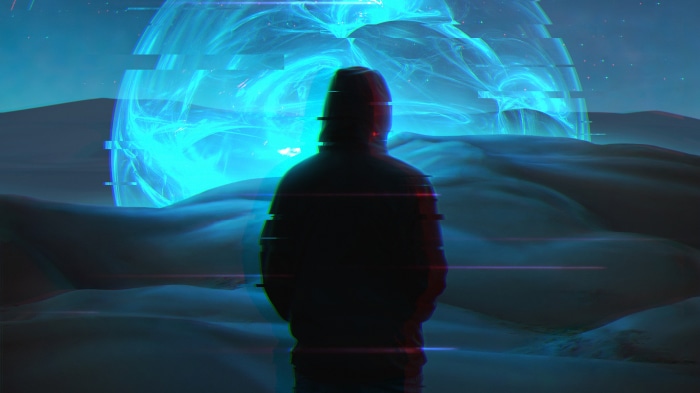 Person in hoodie facing glowing orb in desert landscape