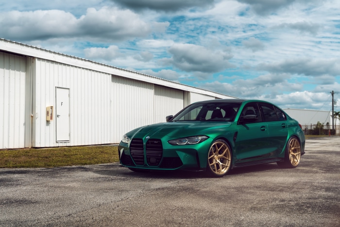 Green BMW M3 with gold wheels