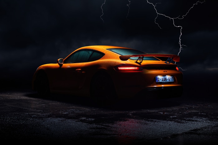Orange Porsche Cayman GT4 with Lightning