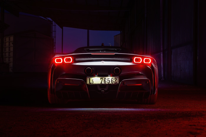 Ferrari SF90 Stradale rear view with red lights