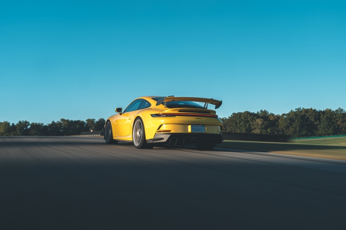 Yellow Porsche 911 GT3 on a Racetrack