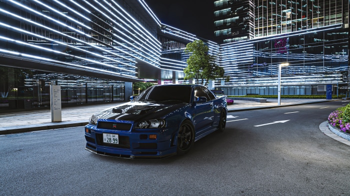 Blue Nissan GT-R R34 parked at night