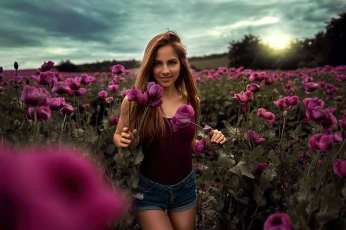 Young Woman in Purple Flower Field