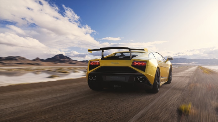 Yellow Lamborghini Gallardo on a Desert Road