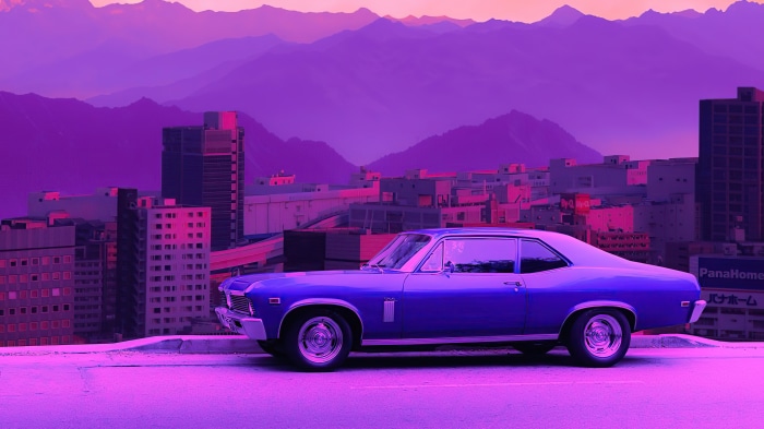 Purple car in a city with mountains at sunset