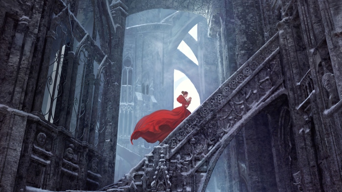 Woman in red dress in gothic ruins