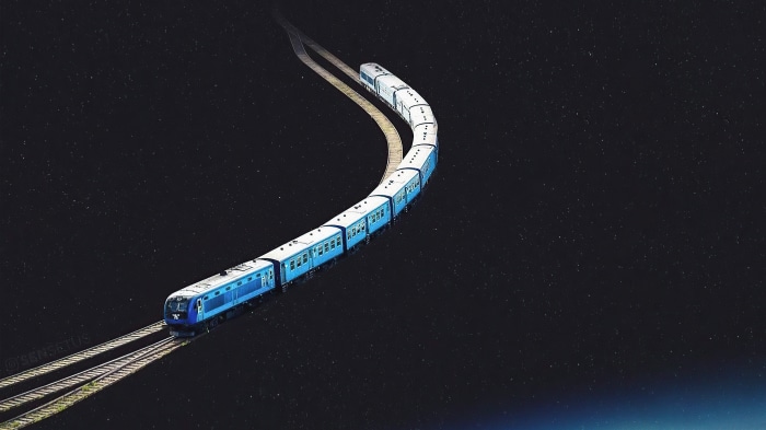Blue train on tracks in starry sky