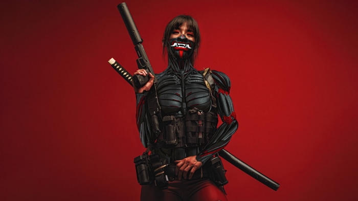 Woman with cybernetic enhancements and mask holding a rifle and katana