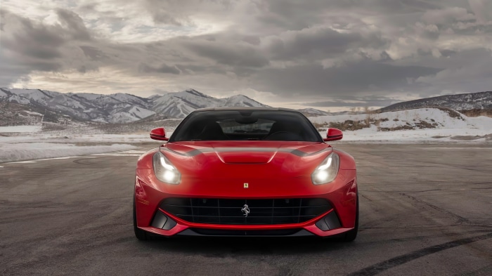 Red Ferrari F12 TDF in Snowy Mountains