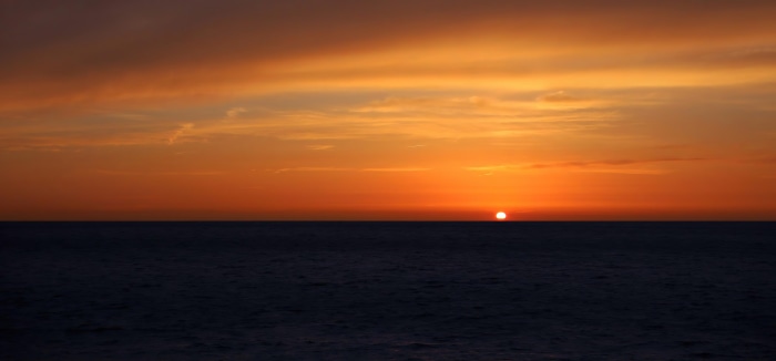Sunset over the sea at dusk