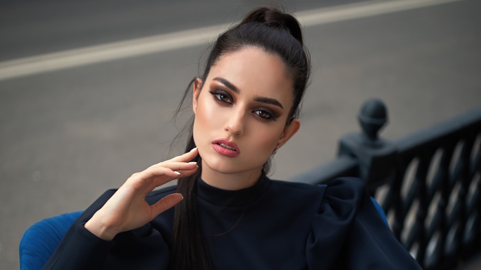 Woman in black dress with makeup