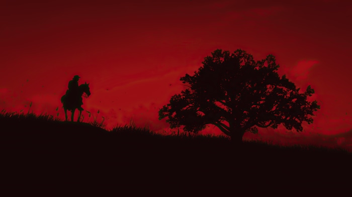 Silhouette of a person on horseback near a tree