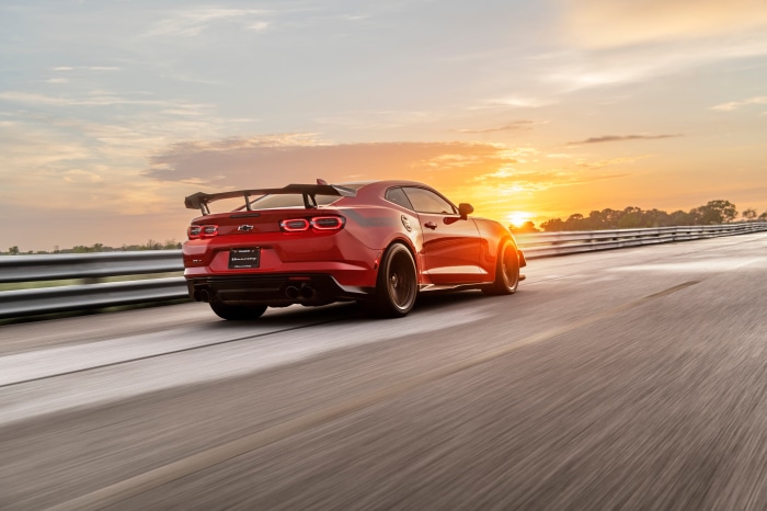 Red Chevrolet Camaro on a Race Track at Sunset