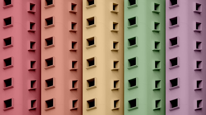 Minimalist building facades with colorful sections and square windows