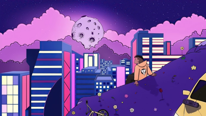 Man in hoodie overlooking a futuristic city at night