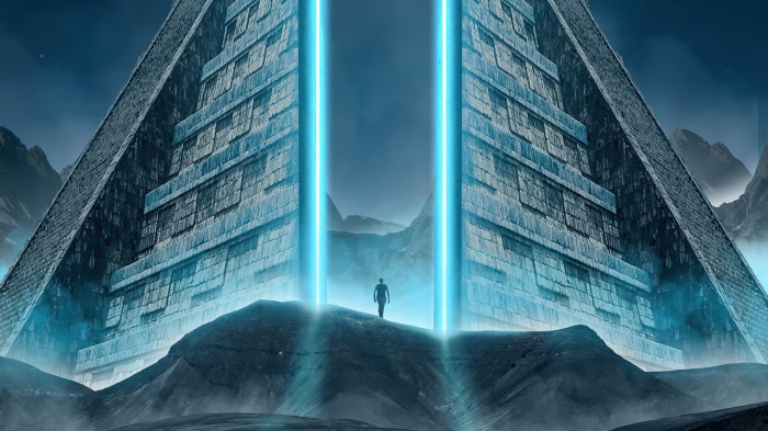 Man standing before a massive alien pyramid with blue energy beams