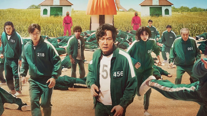 Squid Game players in green tracksuits with numbers
