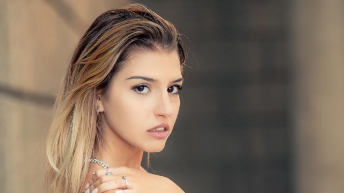 Woman with blonde hair and jewelry