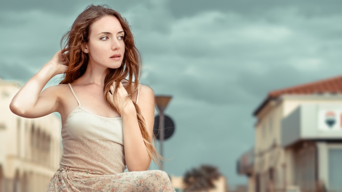 Woman with long brown hair in a dress