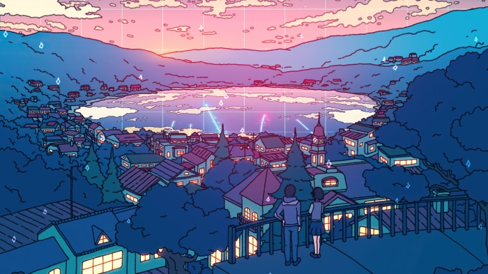 Couple overlooking a town and lake at sunset