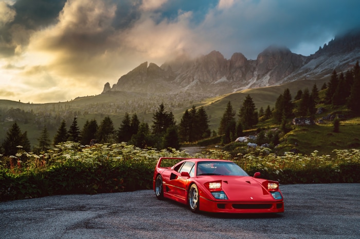 Red Ferrari F40 parked in mountains